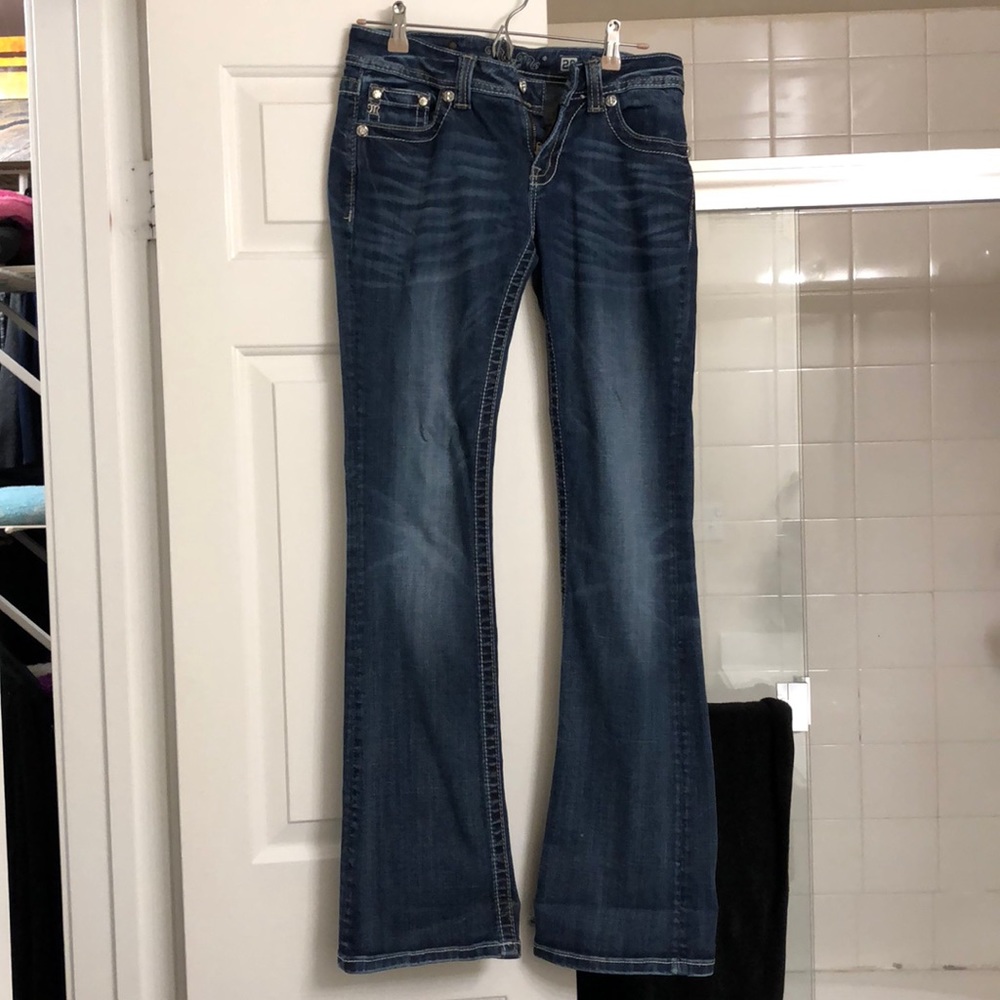 Selling Miss Me jeans.